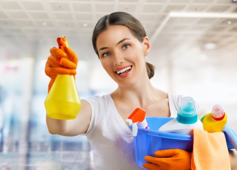Cleaner reaching upper-floor glazing on a W3 property