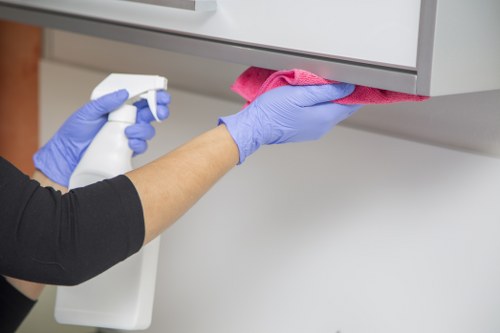 Local cleaner resetting a W3 apartment between guest stays